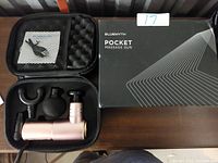 Bluemyth pocket massage gun with box and carrying case; four massage heads and charging cable inside case