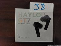 Front view of the Haylou GT7 True Wireless Earbuds box, showing product branding and image of black earbuds.