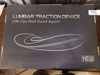 Photo of the box showing the product name 'Lumbar Traction Device' with tagline 'Life Can Feel Good Again!' and labeled as new.