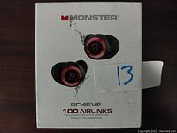 Front view of the Monster Achieve 100 Airlinks wireless in-ear headphones box showing product image and branding