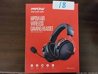 Front view of the red retail box showing the headset image and product name MPOW Air Wireless Gaming Headset.