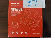 Photo of MPOW M30 earbuds package with image of earbuds and charging case on front of box.