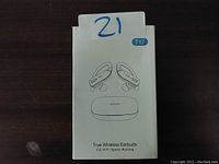 Front of the box showing the image of the T17 True Wireless Earbuds and charging case. Box is white with black text and drawings.