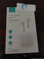 Front of the USAMS IA Series earbud packaging showing model details and product image.