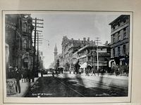 Close-up of the antique black and white photograph depicting King Street West in Toronto with period street scene and architecture.