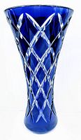 Front view of the tall blue crystal vase showing hand cut diamond and cross patterns.