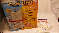 Photo of the product box for Dura Heat portable indoor kerosene heater highlighting features and BTU rating