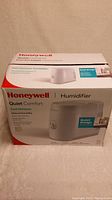 Front view of Honeywell Quiet Comfort Cool Moisture Humidifier box showing product image and branding.