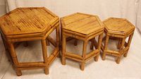 Set of three hexagonal rattan nesting tables in ascending size order, showing overall form and style.