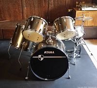 Full Tama Imperialstar five-piece drum kit setup including bass drum, two rack toms, floor tom and snare on mat surface