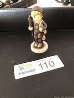 Front view of the Hummel Goebel Ramoneur Chimney Sweep porcelain figurine standing upright.