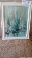 Framed painting showing sailboats on a teal and blue water background with an abstract impressionistic style.