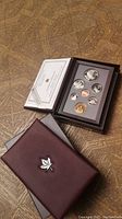 1994 Canadian Mint Uncirculated Coin Set in open maroon case showing seven coins and interior certificate.