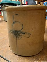 Front view showing cobalt blue “5” and swirl decoration