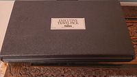 Black textured carrying case labeled 'Executive Travel Pack' by Daiwa.