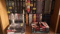 Shelf with multiple CSI DVD seasons and other TV series DVD sets like NCIS, Bones, Criminal Minds, Castle, Inspector Lynley, and Jacques Cousteau.