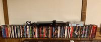 Wide shot of DVD collection and Sony Blu-Ray player on shelf
