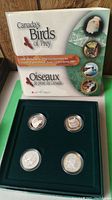 Original mint box with 'Canada's Birds of Prey' title and four coins in protective cases in green velvet display tray.