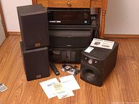 Grouped view showing receiver, speakers, centre channel, CD changer and subwoofer