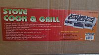 Photo of the box showing the product name, features, and specs of the Stove Cook & Grill tabletop unit.