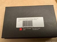 Closed black box with Royal Canadian Mint label and barcode indicating Transportation Hologram Series Ship 2001.