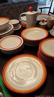 Full set laid out on table showing variety of plates, bowls and serveware