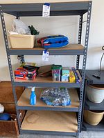 Full front view of shelving unit showing structure and contents used for scale only.