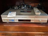 Front view of Sony Hi-Fi Stereo VHS VCR with Sony and Hi-Fi Stereo branding, RCA inputs, control buttons, and power switch.