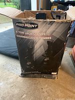 Damaged original packaging box for ProPoint 6 ton jack stands with product branding and weight capacity visible