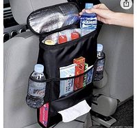 Photo showing black thermal insulated car seat organizer hung on vehicle seat back with bottles and snacks inside, tissue dispenser visible.