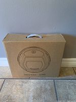 Front view of sealed Lefant robot vacuum box showing product drawing and branding