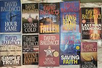 First photo showing 11 hardcover books by David Baldacci with clear titles and very good condition.