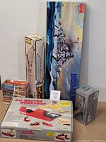 Lot of vintage toy model kits with boxes including German Battleship Bismarck and 4-in-1 Master Wood Workshop