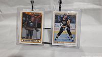Front view of two hockey rookie cards: Alexander Mogilny Topps card and Jaromir Jagr O-Pee-Chee card, both in protective sleeves.