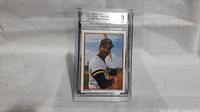Front image of Barry Bonds 1987 Topps Glossy Send-Ins Rookie card graded Mint 9 by Beckett in protective slab.