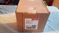 Photo of the sealed cardboard box showing model number and Honeywell branding.