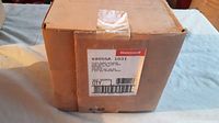 Box of Honeywell Fluid Power Gas Valve V4055A 1031 with visible product label showing part information.