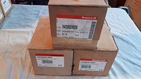 Three Honeywell boxes labeled V4295S1005 stacked together showing packaging and labels.