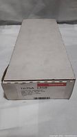White cardboard box with Honeywell logo and product label showing model T675A 1458 and product details.