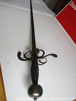 Full view of rapier showing overall length, swept guard and blade.