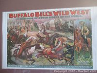 Full view of the framed Buffalo Bill's Wild West show poster with colorful western scene and text.