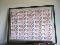 Framed uncut sheet of Canadian $2 bills, full view of front