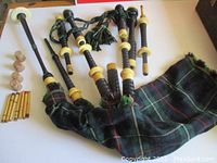 Bagpipe components and extra fittings laid out