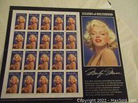 Full sheet of Marilyn Monroe stamps inside album with accompanying biographical card.