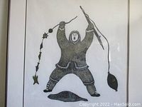 Full view of the framed stone-cut print showing the artwork centered within the mat and frame.