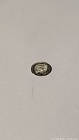 Oval cut mint green sapphire gemstone approx 1.23 carats on white background