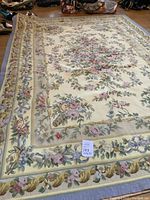 Full view of entire rug laid flat on floor showing overall design, colors and condition