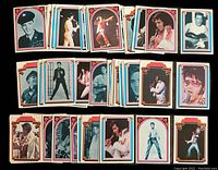 Layout of spread trading cards showing multiple Elvis Presley images in classic and stage photos with colorful borders.