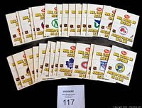 Photo of all 24 cards from the 1981-82 Post NHL Stars in Action set showing their team logos on card fronts.