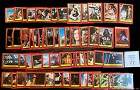 Photo showing 58 vintage Return of the Jedi collector cards arranged in rows. Cards have red borders with yellow trim and feature various scenes and characters from the movie.
